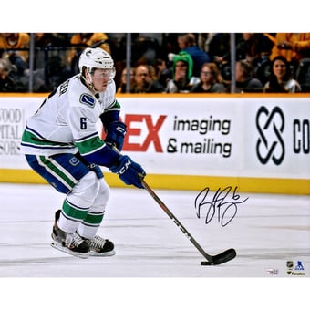 Brock Boeser Vancouver Canucks Autographed 16" x 20" White Jersey Skating with Puck Photograph