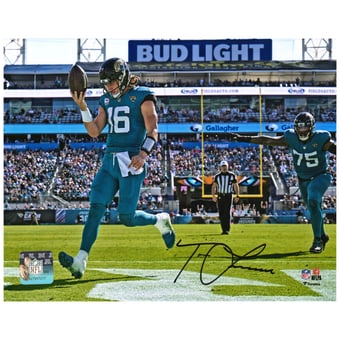 Trevor Lawrence Jacksonville Jaguars Autographed 8'' x 10'' Teal Jersey Rush Touchdown Photograph