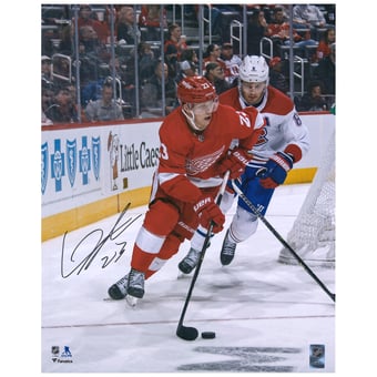 Lucas Raymond Detroit Red Wings Autographed 16" x 20" Red Jersey with Puck Photograph