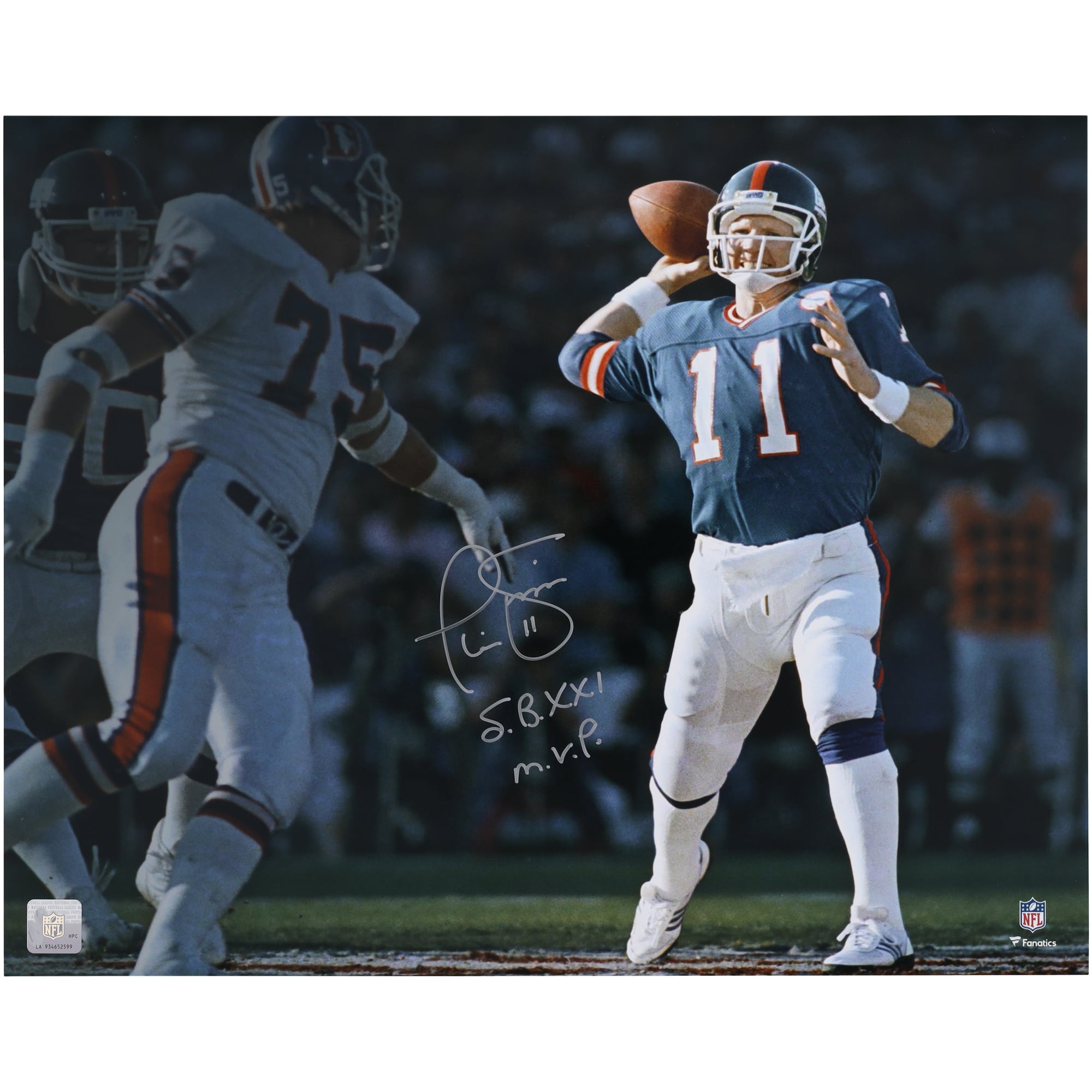 Phil Simms New York Giants Autographed 16" x 20" Super Bowl XXI vs. Broncos Spotlight Photograph with "S.B. XXI M.V.P." Inscription