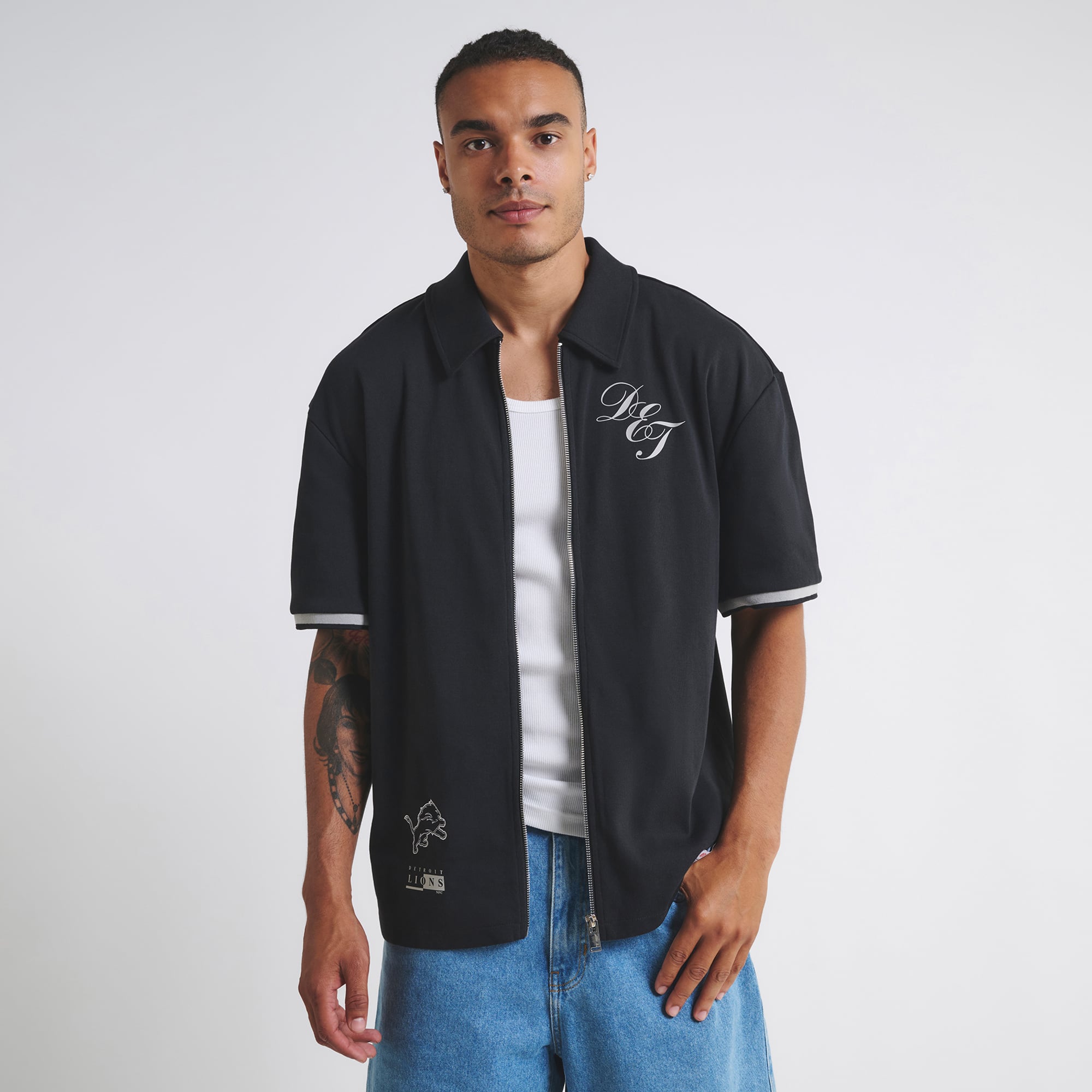 Camiseta unisex negra con cremallera de los Detroit Lions