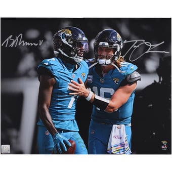 Trevor Lawrence & Brian Thomas Jr. Jacksonville Jaguars Autographed 16" x 20" Teal Jersey Spotlight Photograph
