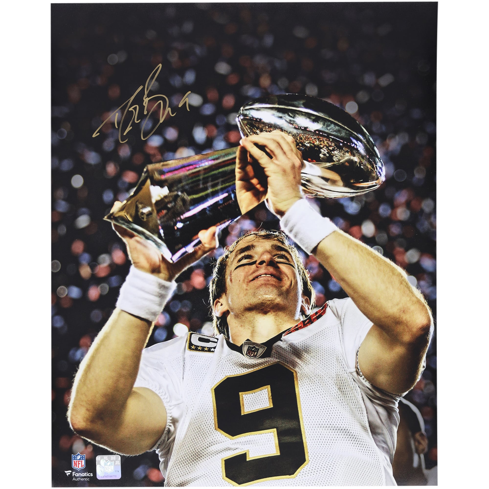 Drew Brees New Orleans Saints Autographed 16" x 20" Holding Lombardi Trophy Spotlight Photograph